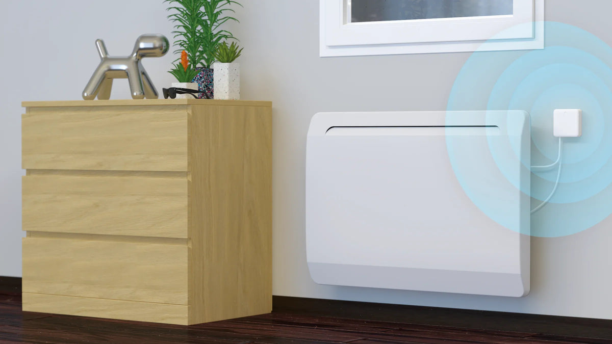 Actuador Calefacción Eléctrica Zigbee NodOn instalado junto a un radiador eléctrico